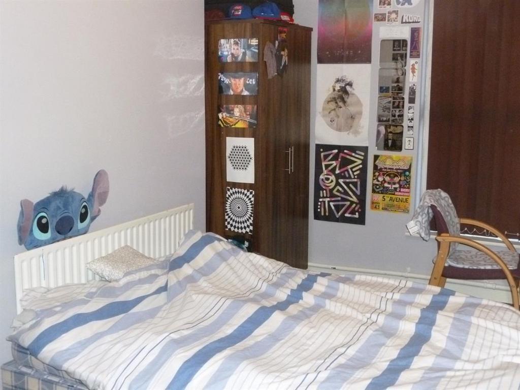 Cozy furnished bedroom with a double bed, wardr...