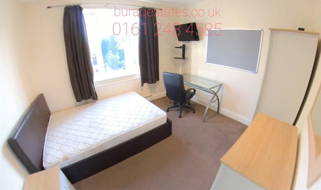 Bright, simply furnished double bedroom with a ...