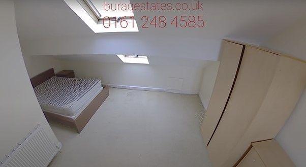 Bright, simply furnished attic bedroom with a s...