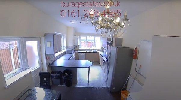 Bright, practical communal kitchen with multipl...