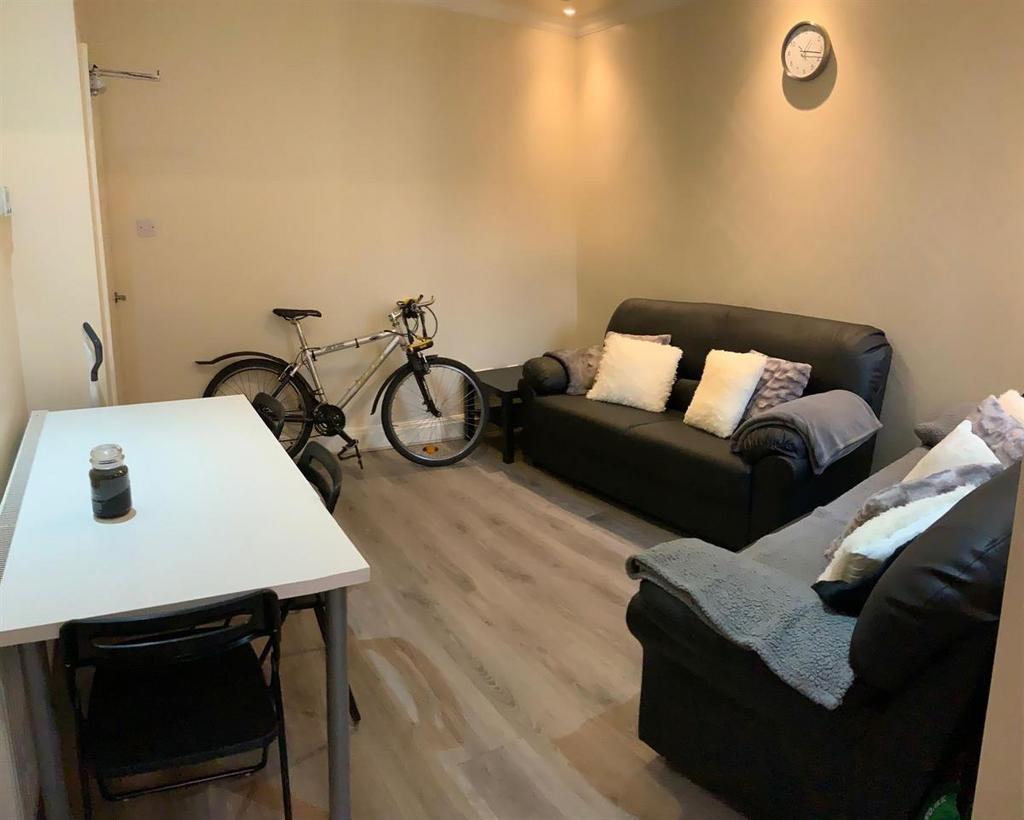 Comfortable living room with two leather sofas,...