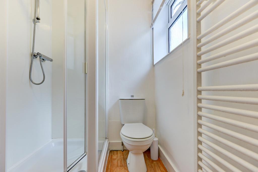 Bright, modern bathroom with a walk-in shower, ...
