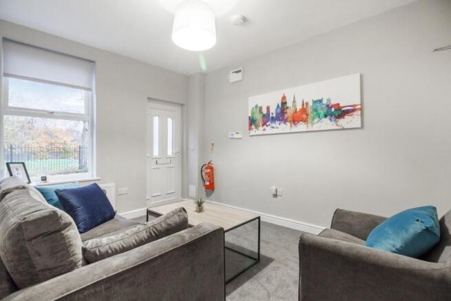 A bright and spacious living room featuring mod...