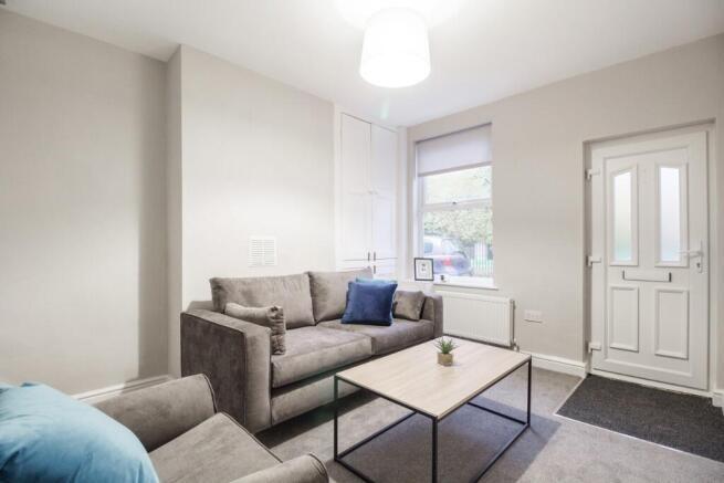 Bright and welcoming living room with comfortab...