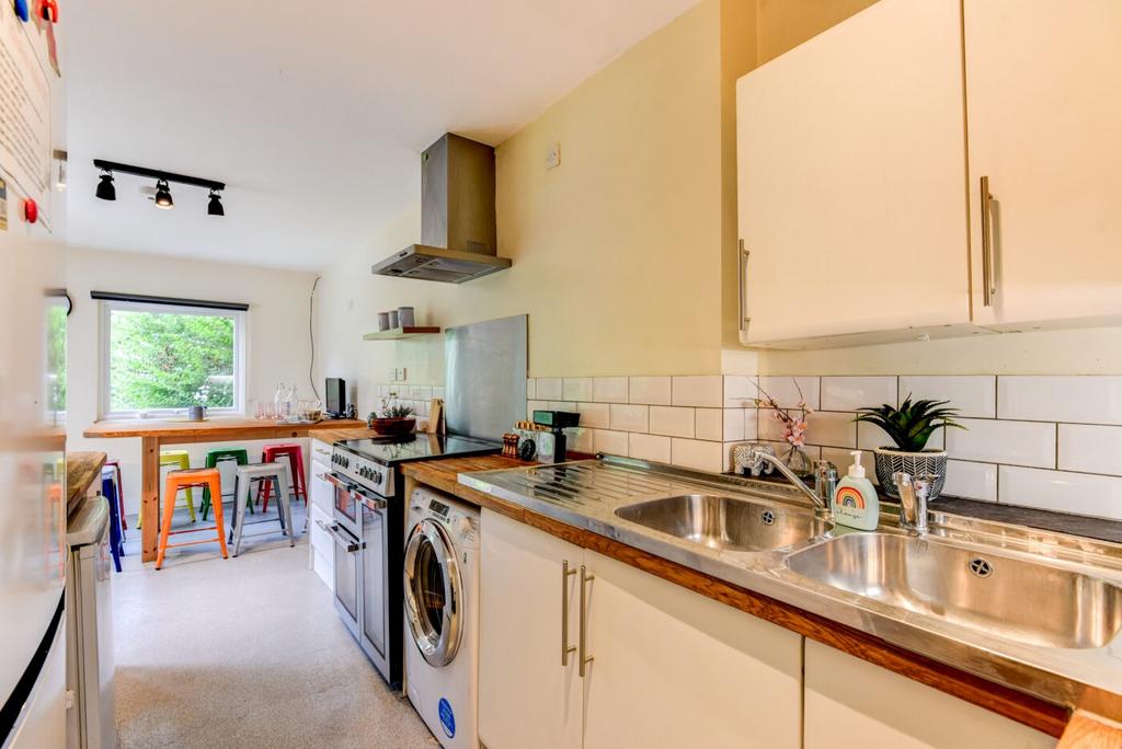 Bright and welcoming kitchen with modern applia...