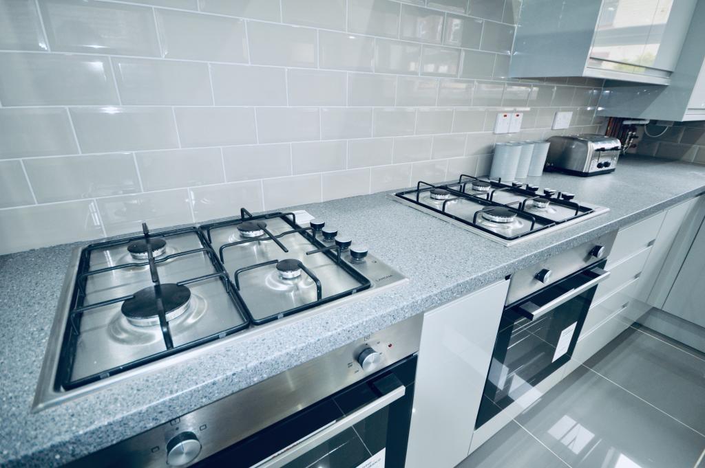A modern, well-maintained kitchen featuring a s...