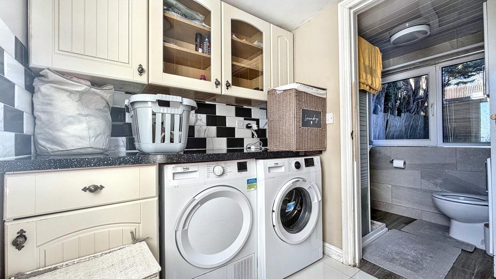 Well-equipped kitchen area with integrated wash...