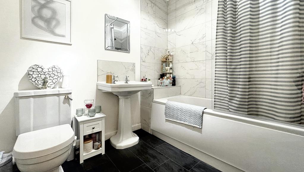 Bright, modern bathroom with white sanitaryware...