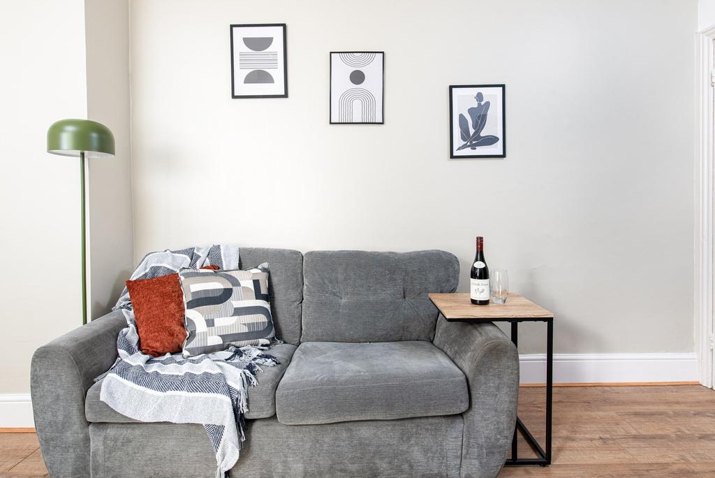 Cozy modern living area with a comfortable grey...