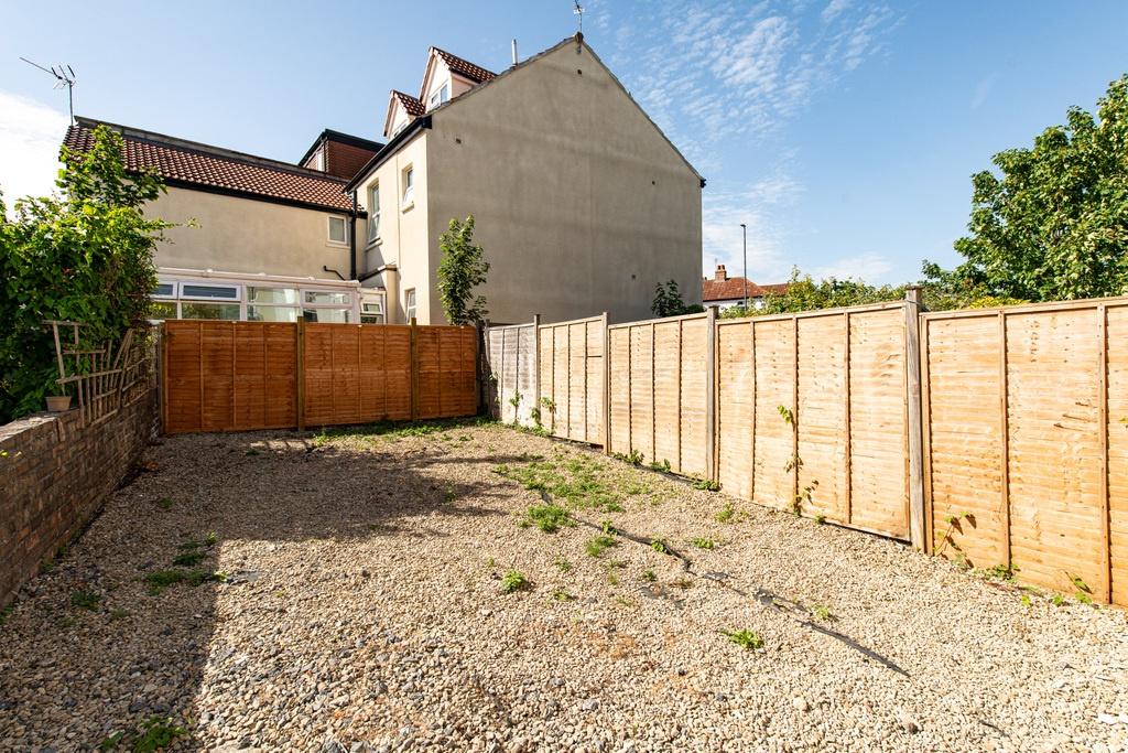 Private rear garden with secure timber fencing,...