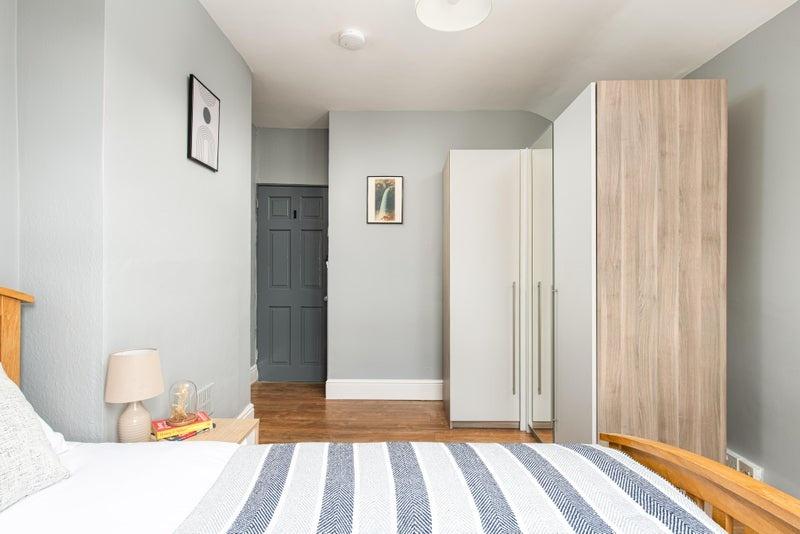Bright, neatly presented bedroom with a double ...