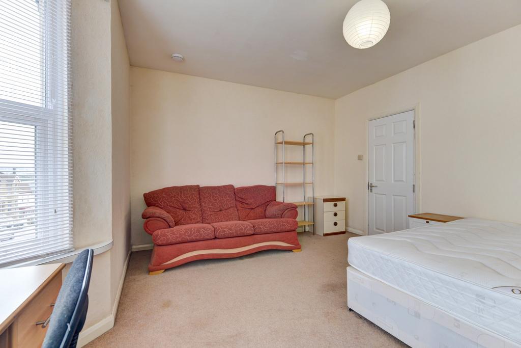 A spacious master bedroom featuring a large dou...