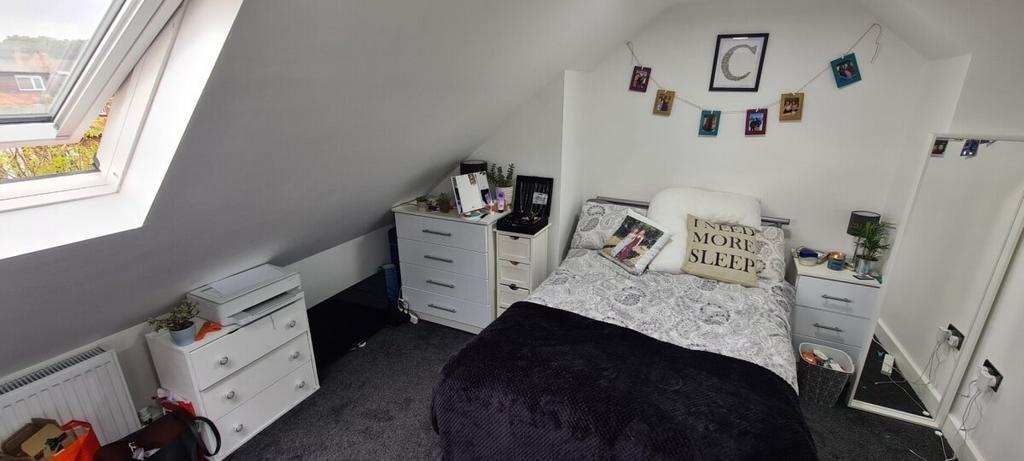 Bright and cozy bedroom with a comfortable doub...
