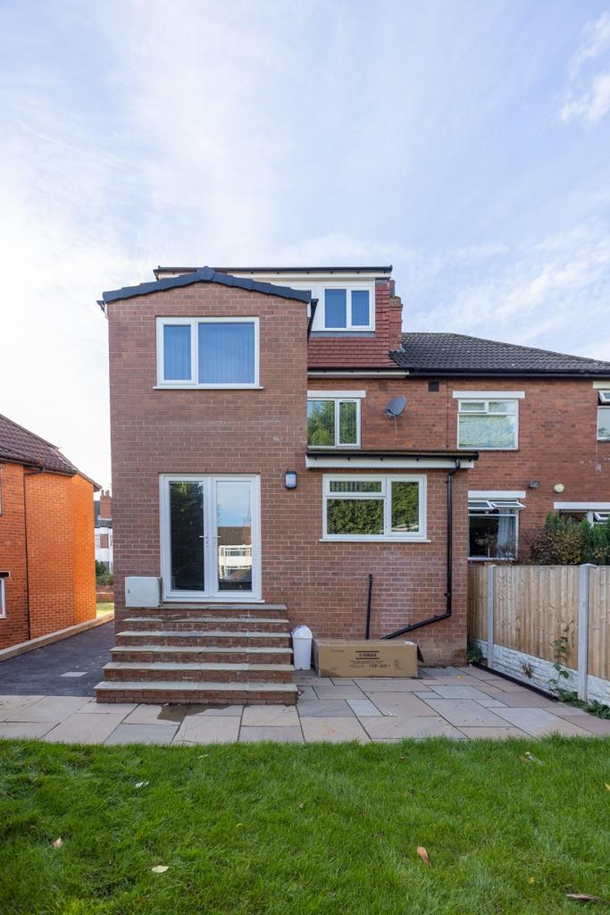 The exterior of a charming brick house featurin...