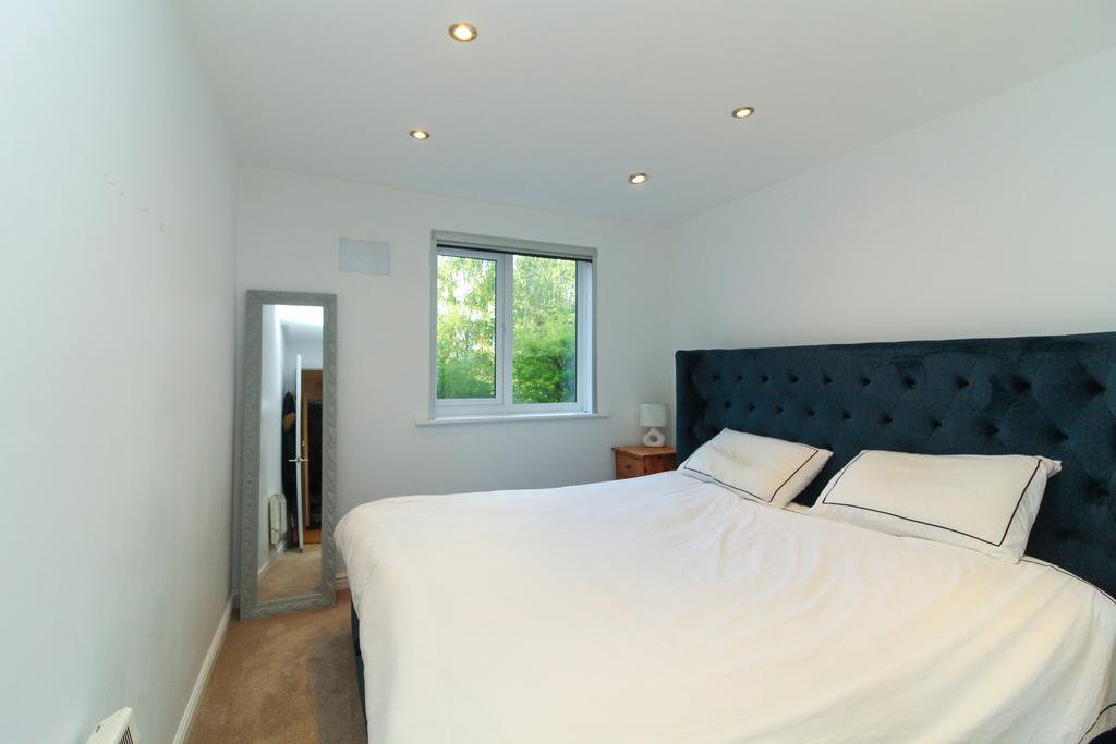 Bedroom with views over communal grounds