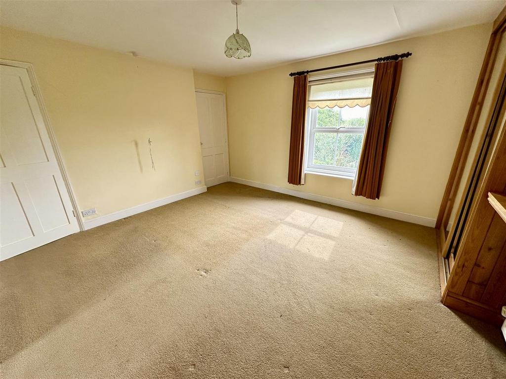 Bedroom one with rear aspect.JPEG