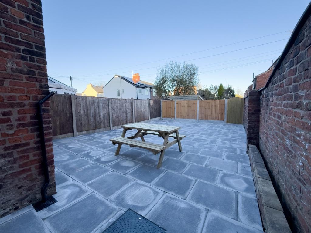 Private paved courtyard with picnic bench, encl...