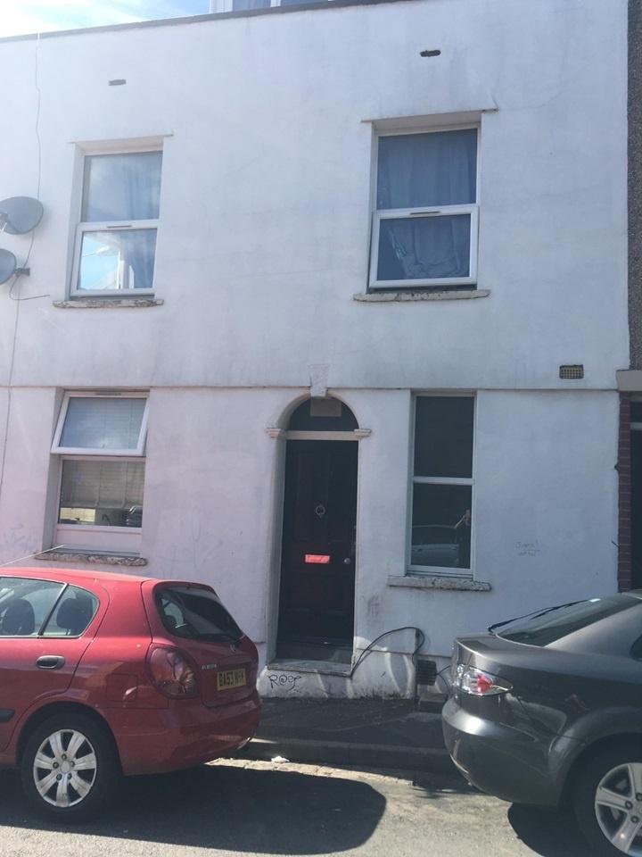 Street-facing two-storey property with a white ...