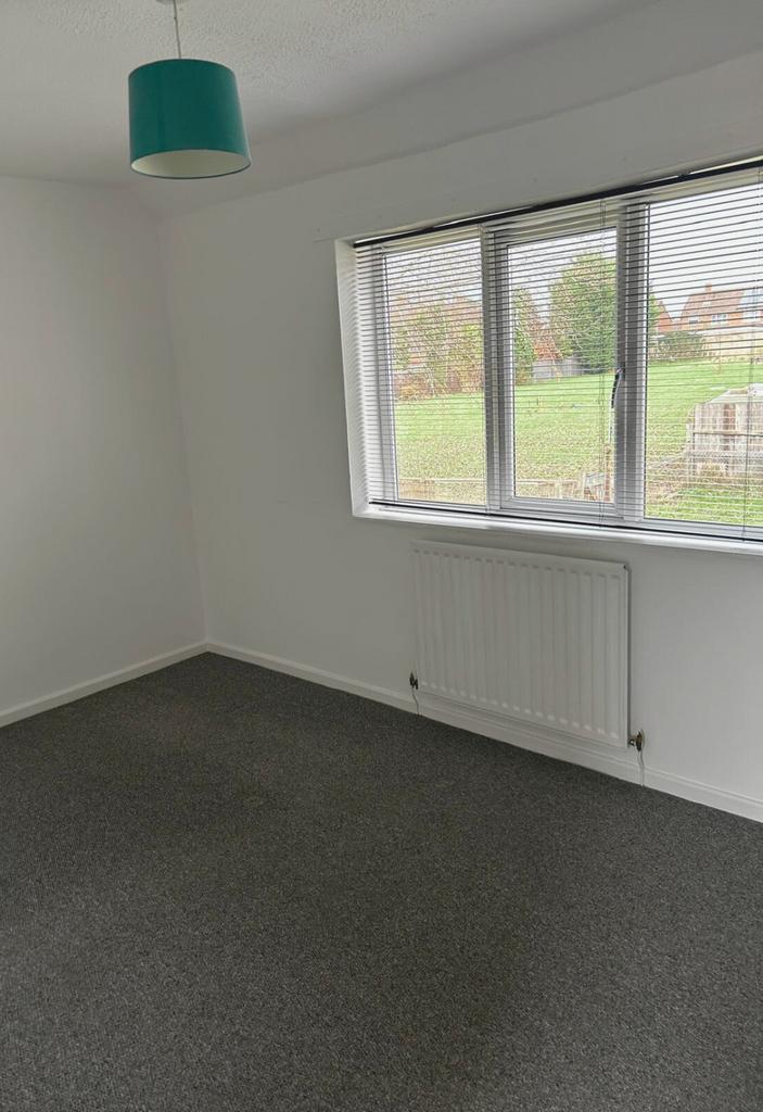 Bright, freshly decorated bedroom with a large ...