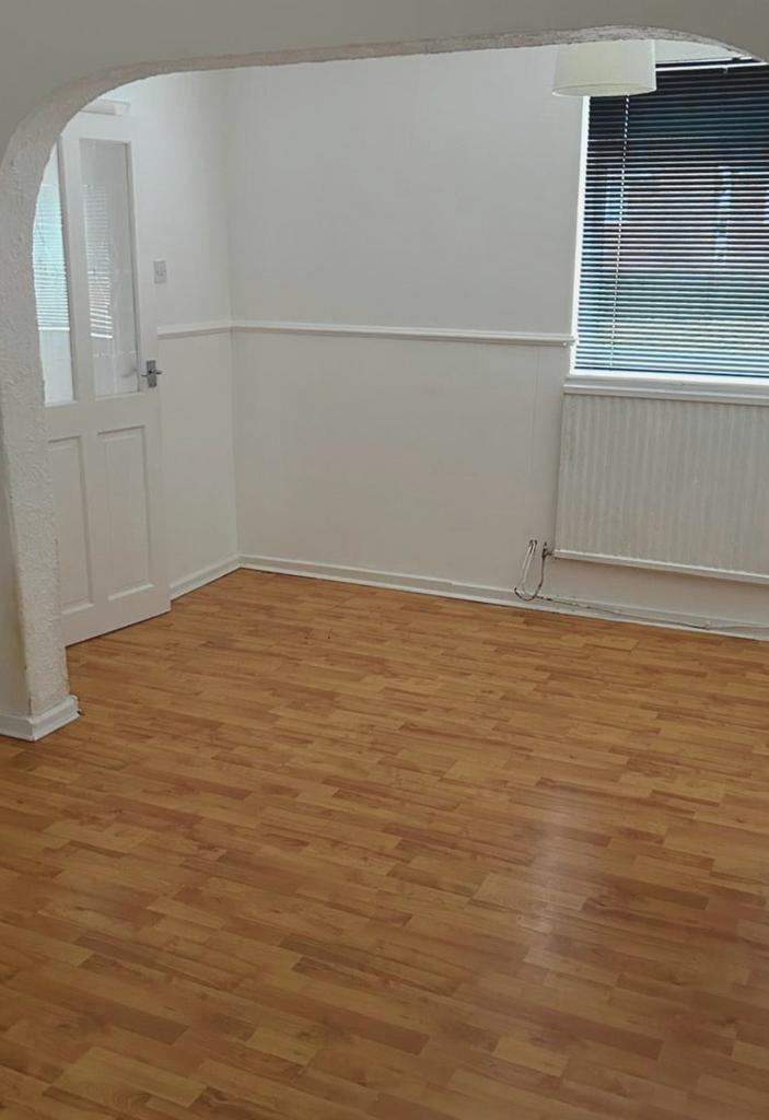 Bright, freshly painted living space with warm ...