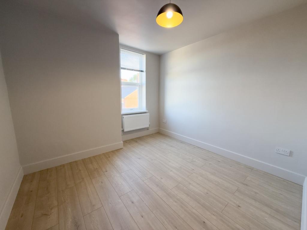 Bright, freshly painted bedroom with new-lookin...