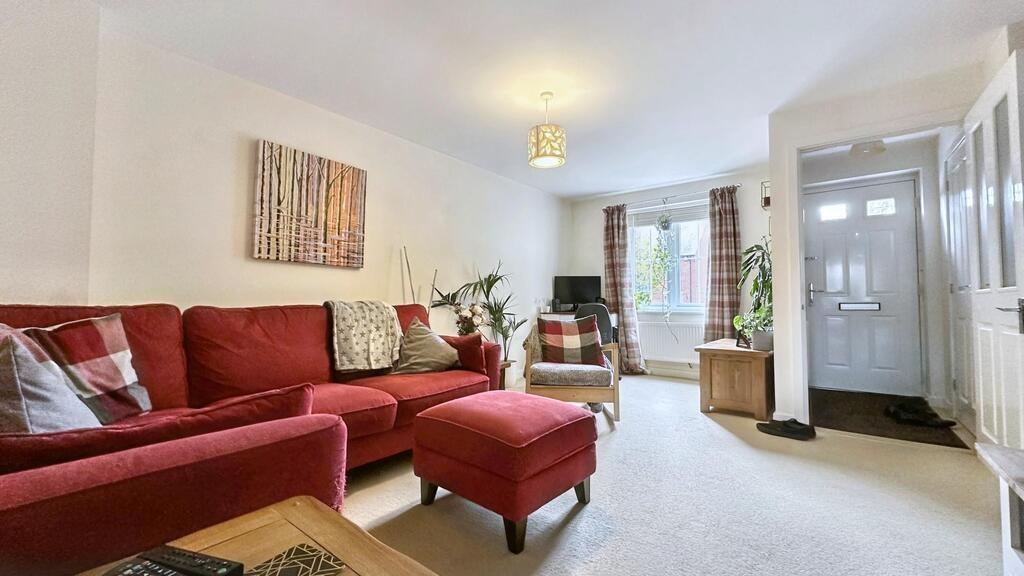 Bright, welcoming living room with a comfortabl...