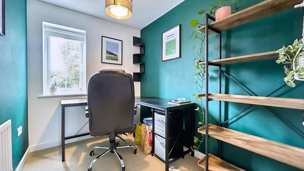 Bright, modern workspace with a sleek desk, erg...