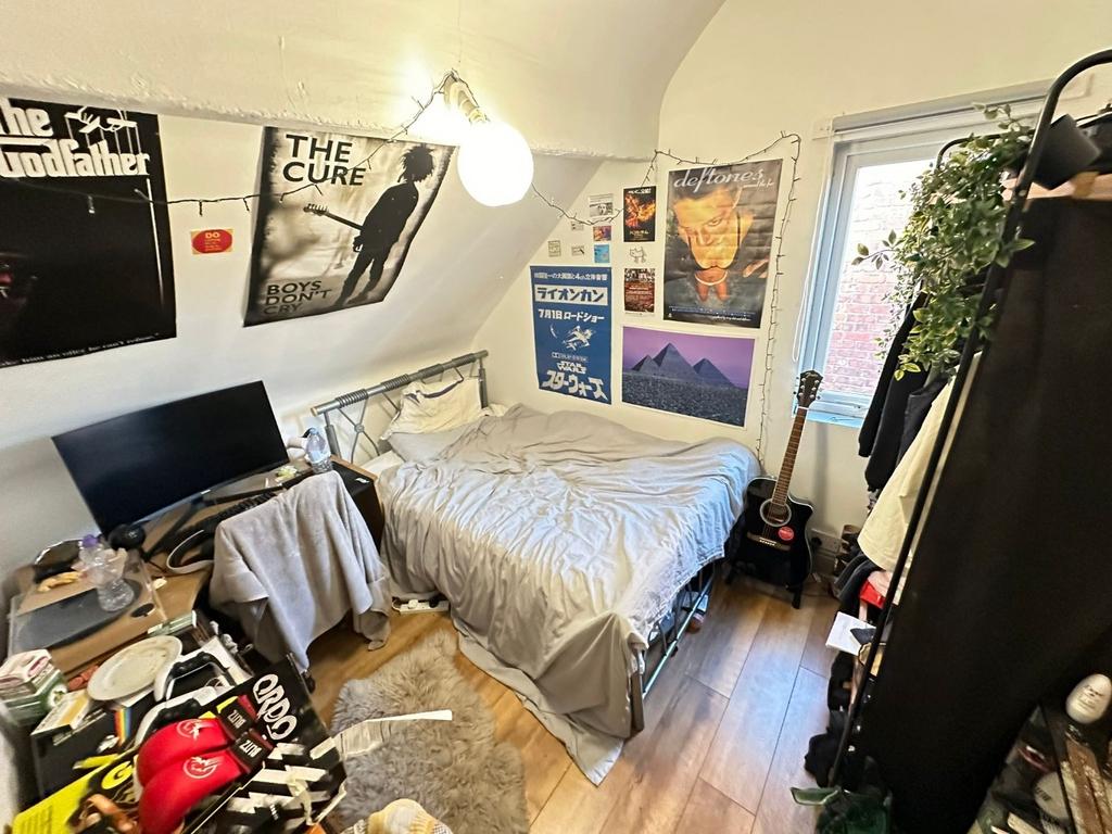 Bright, cozy bedroom with a double bed, natural...