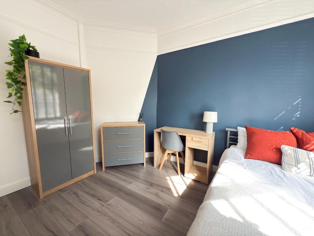 Bright, modern bedroom with a comfortable bed, ...
