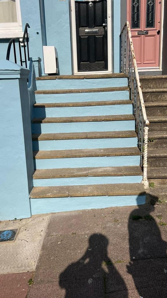 A charming set of exterior steps leading up to ...