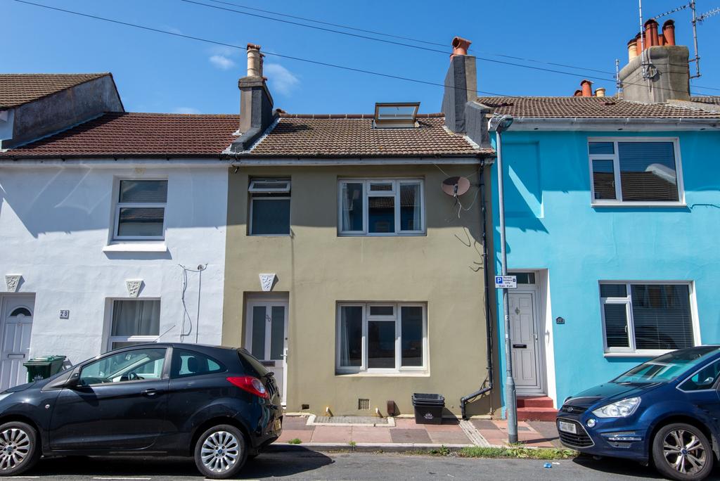 Row of well-kept terraced houses with on-street...