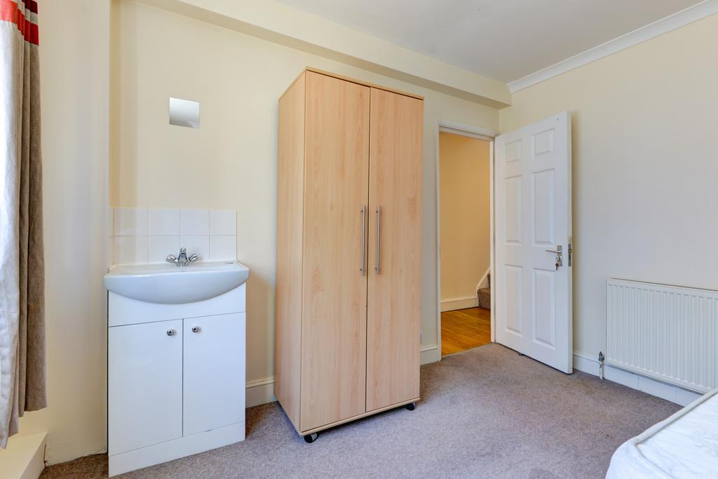 Bright, tidy bedroom with neutral décor, fitted...