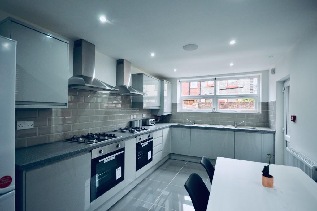 Bright and modern kitchen with ample natural li...