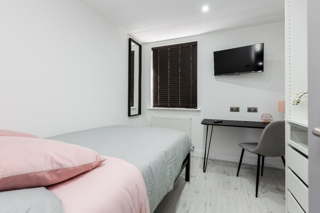 Bright and inviting double bedroom featuring a ...