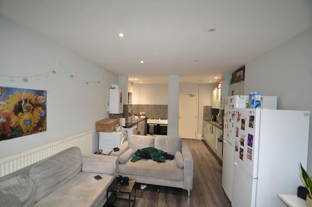 Bright and spacious kitchen area featuring mode...