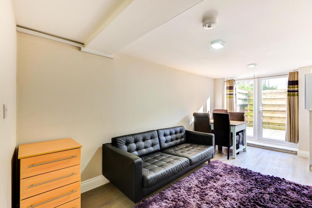 Bright, modern living area with a comfortable b...