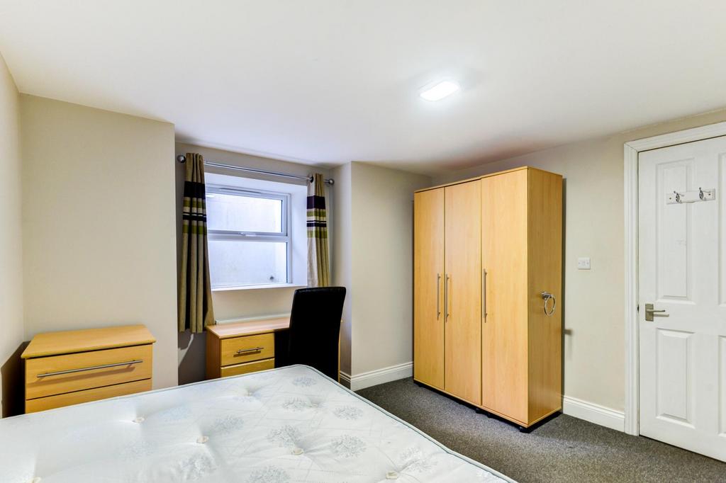 Bright, neatly presented bedroom with a double ...