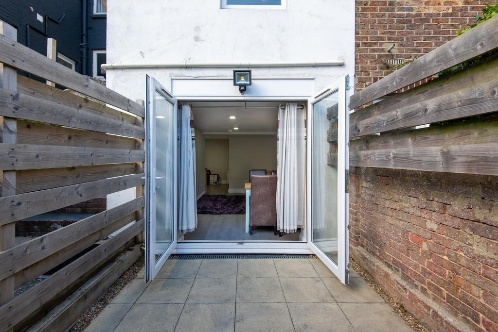 Contemporary ground-floor living area opening o...