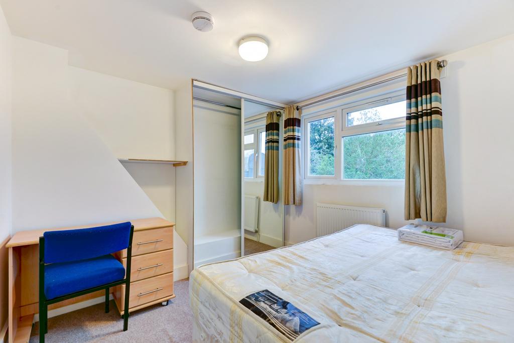 Bright and spacious master bedroom featuring a ...