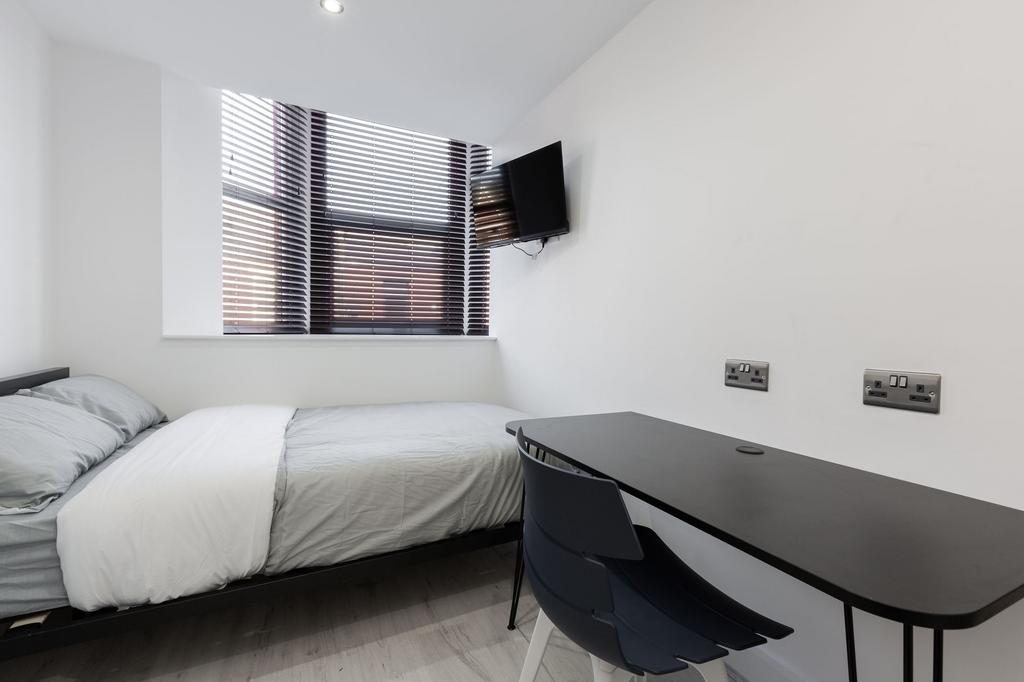Bright and minimalist student bedroom featuring...