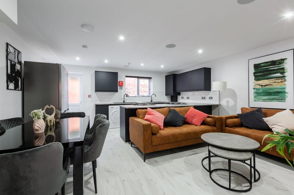 A modern, spacious living room featuring contem...