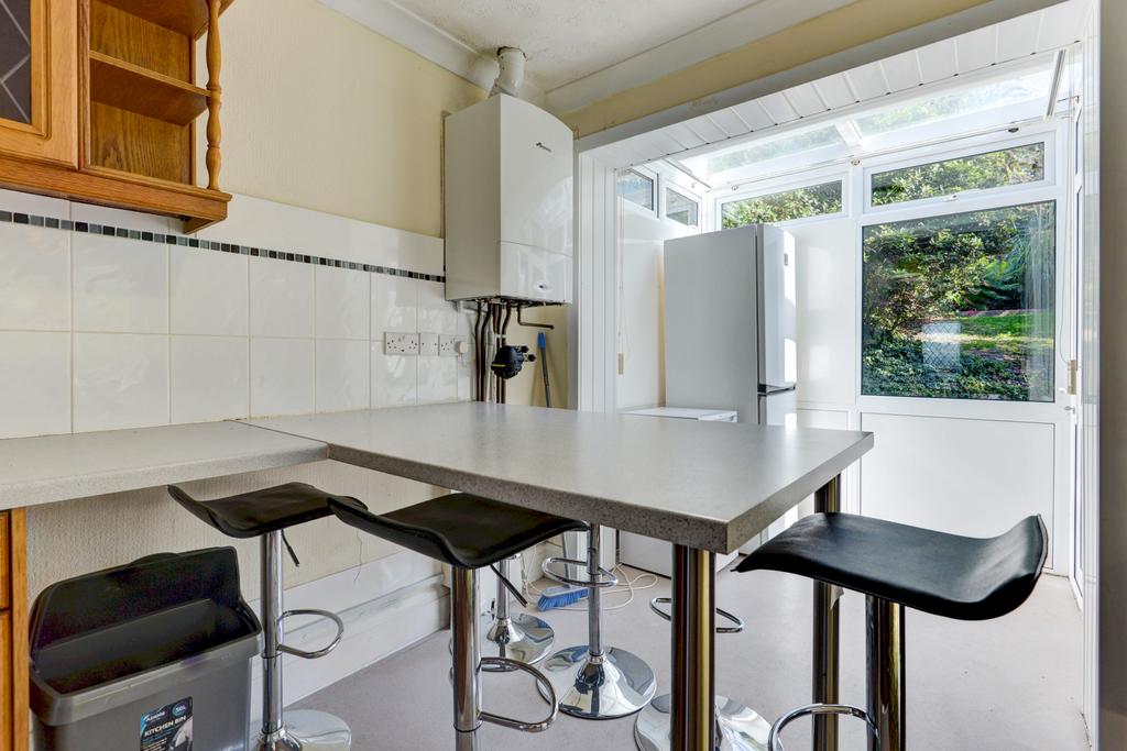 A bright, clean kitchen area with good natural ...