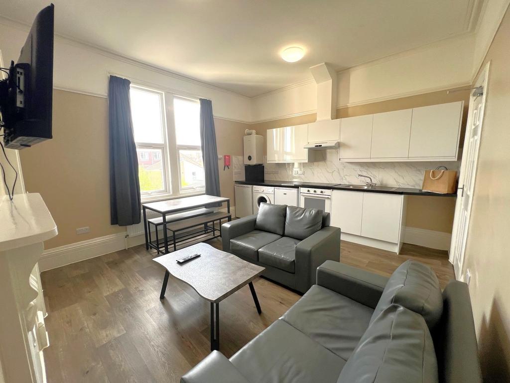 Bright, modern open-plan living area with a fit...