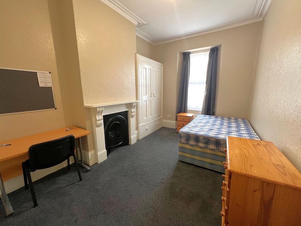 Bright furnished double bedroom with high ceili...