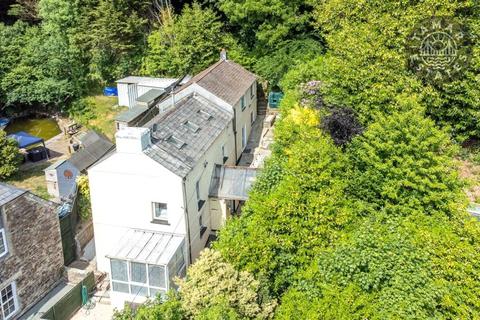 'Picture-perfect detached cottage blending period charm with everyday comfort'