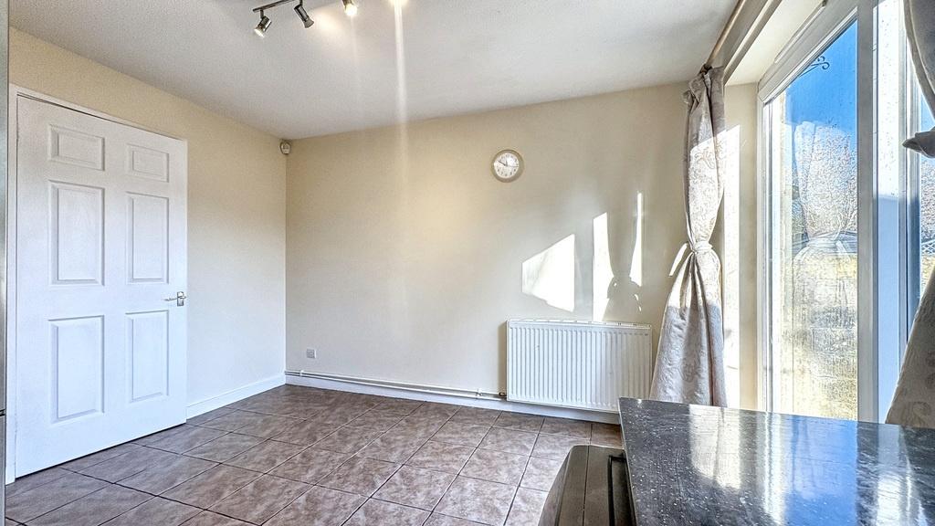 Bright, versatile living room with large window...