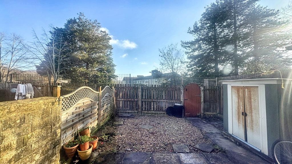 Sunny private rear garden with paved patio, bou...