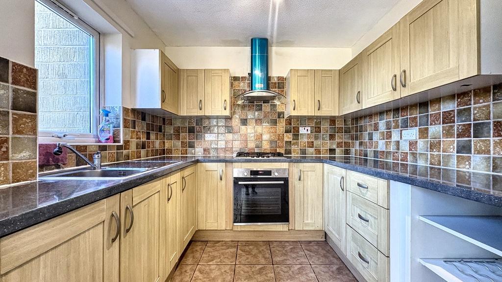 Bright, well-equipped kitchen with plenty of co...