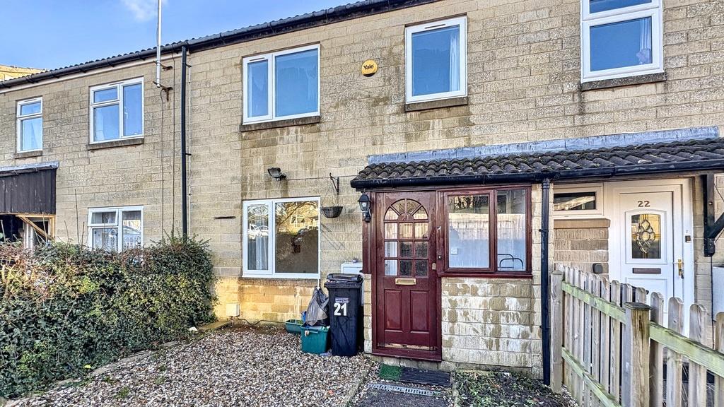 Attractive terraced house exterior with a grave...