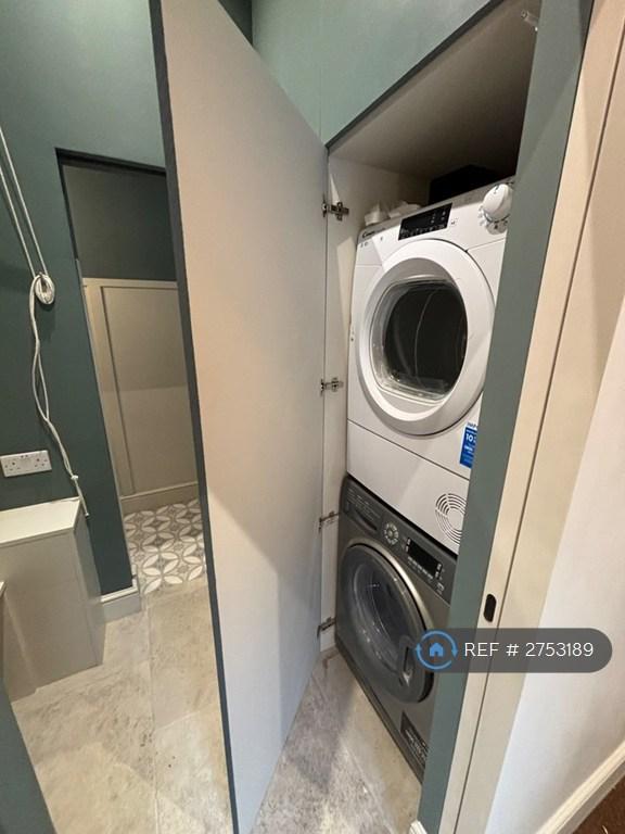 Utility Boot Room With Washer And Dryer